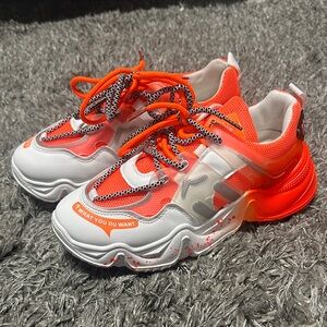 Woman’s Orange and White Sneakers